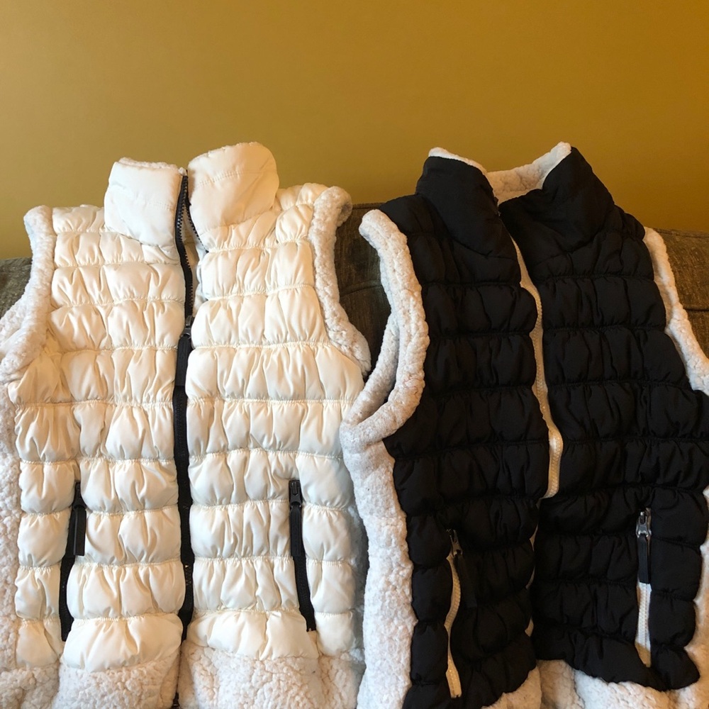 2 Calvin Klein Sherpa trim puffer vests.